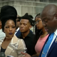 Nancy Davis, in front of microphone, spoke about her experience in front of the Louisiana Capitol in August.
